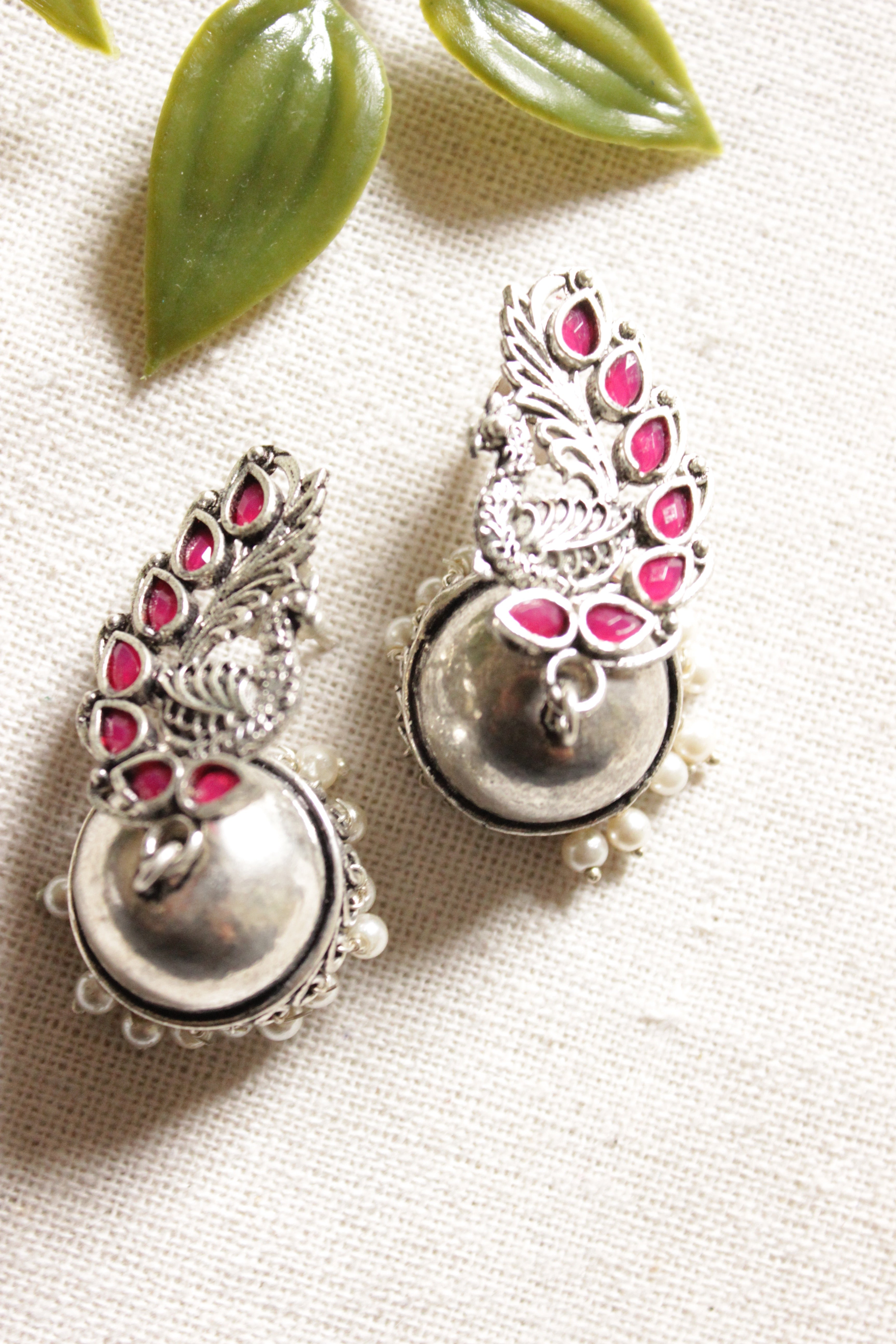Peacock Shape Oxidised Finish Pink Glass Stones Embedded Jhumka Earrings