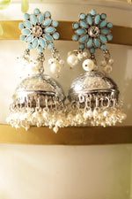 Load image into Gallery viewer, Turquoise Glass Stones Embedded Silver Finish Jhumka Earrings
