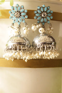 Turquoise Glass Stones Embedded Silver Finish Jhumka Earrings