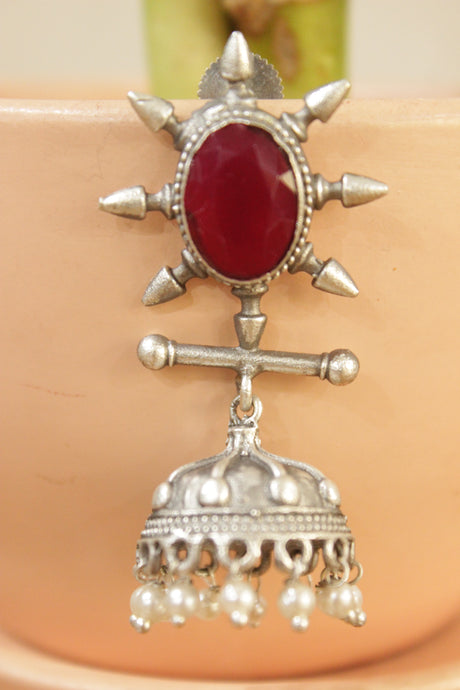 Ruby Red Gemstone Embedded Warrior Motif Silver Finish Brass Jhumka Earrings