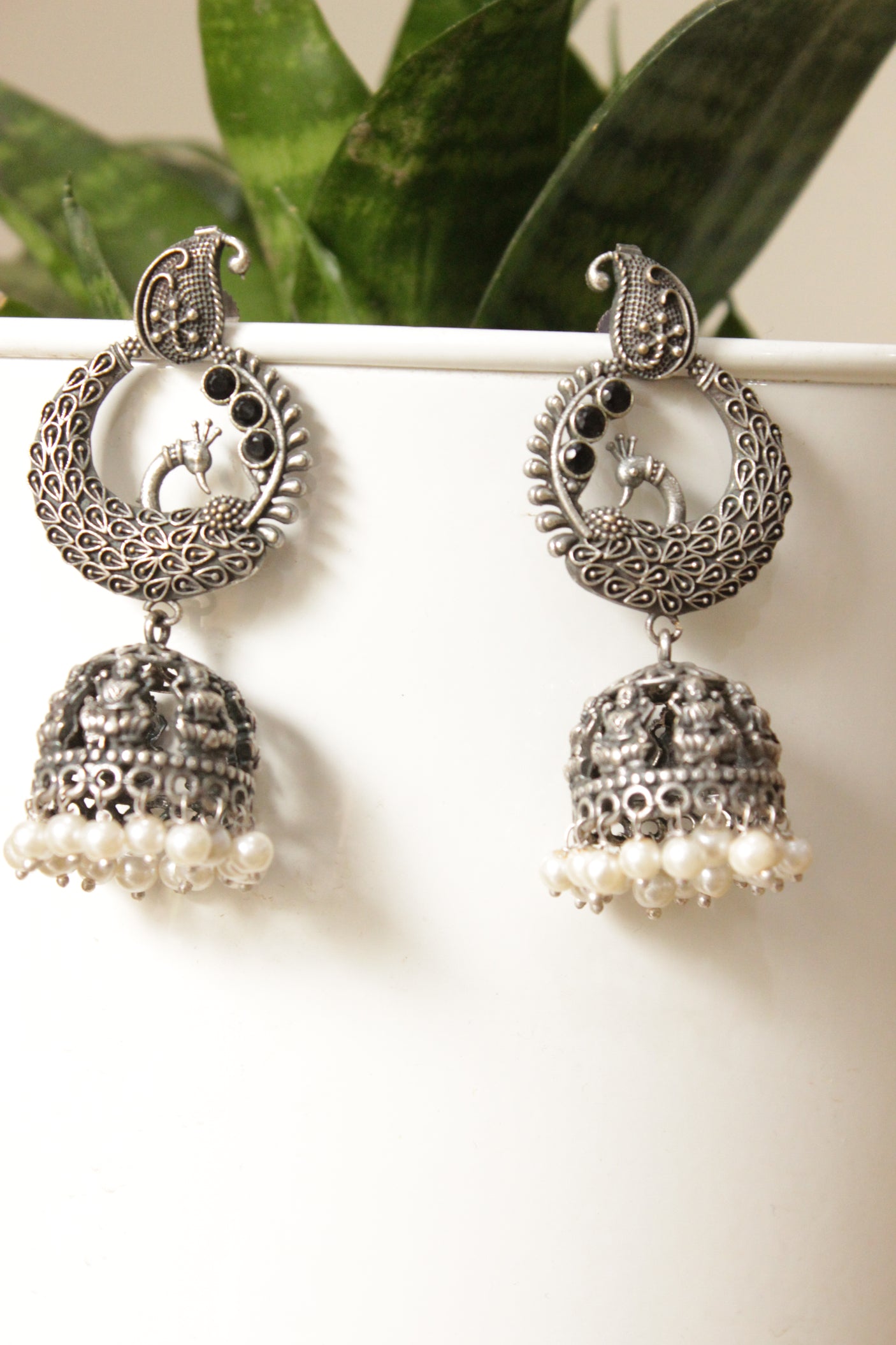 Oxidised Finish Peacock Jhumka Earrings Embellished With White Beads
