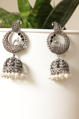 Oxidised Finish Peacock Jhumka Earrings Embellished With White Beads