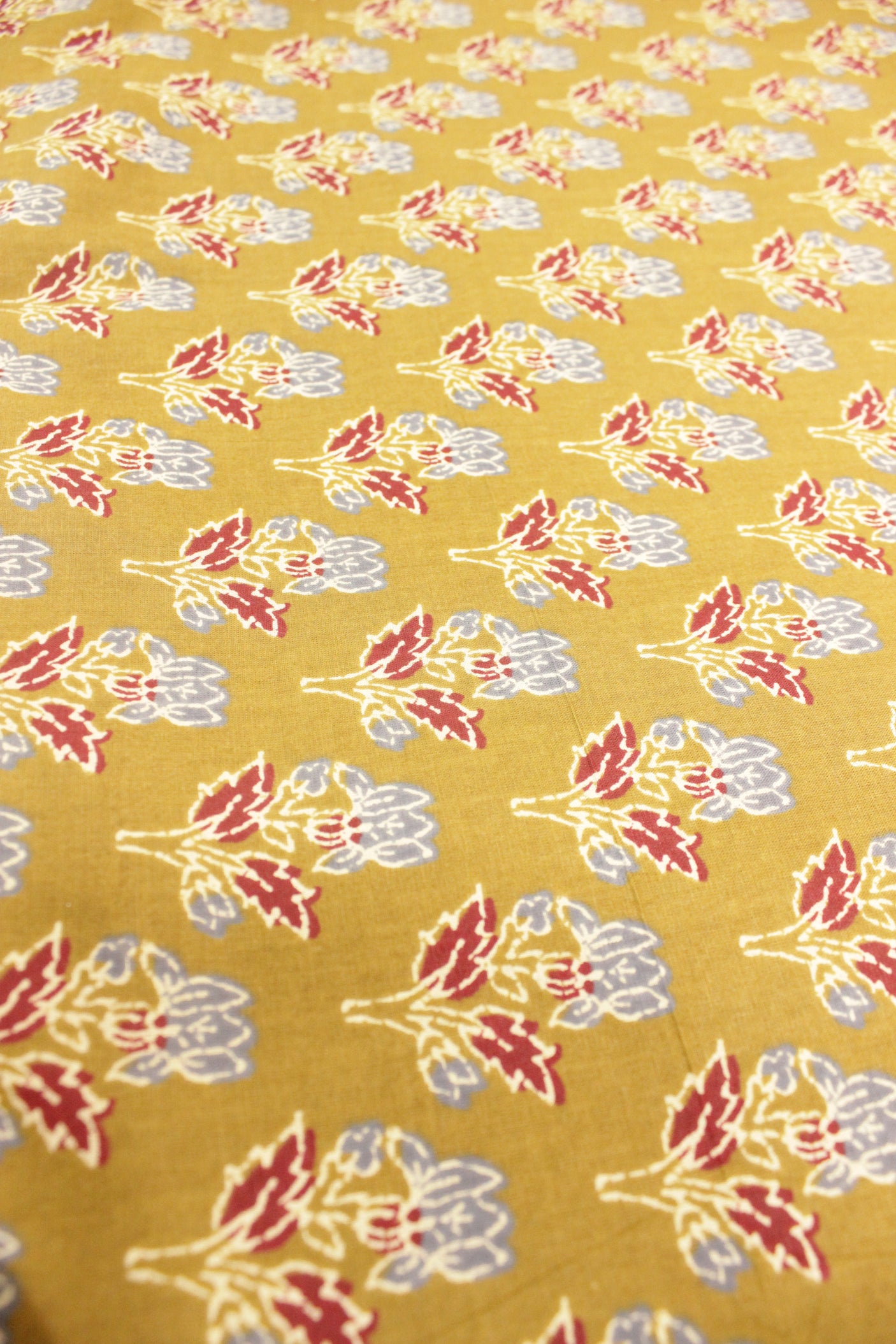 Mehendi Green with Hints of Red and Grey Flower Motifs Premium Cotton Fabric