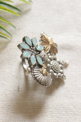 Dual Tone Premium Metal Flower Motifs Blue Stones Embedded Statement Cocktail Ring