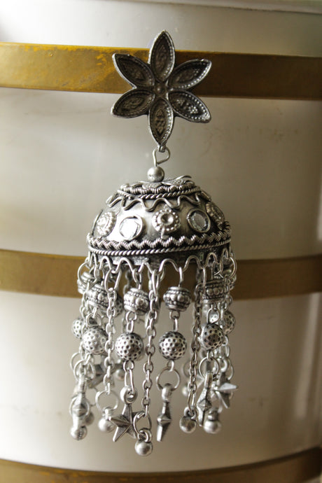 Premium Oxidised Finish Flower Jhumka Earrings with Long Metal Charm Strings