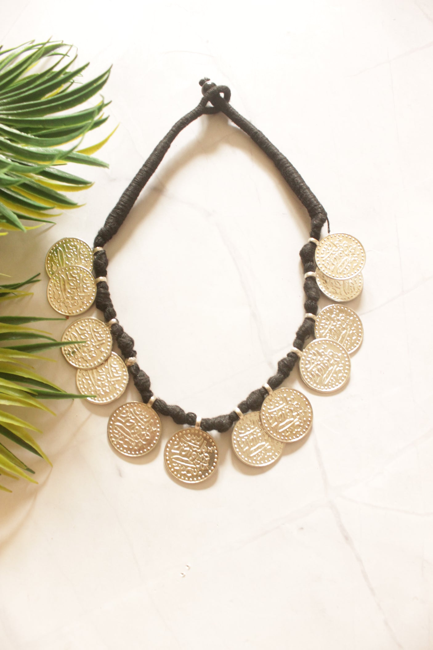 Stamped Metal Coins Braided in Black Fabric Threads Necklace