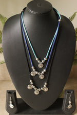 Load image into Gallery viewer, 3 Layer Rope Necklace with Religious Motif Stamped Metal Charms
