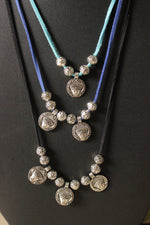 Load image into Gallery viewer, 3 Layer Rope Necklace with Religious Motif Stamped Metal Charms
