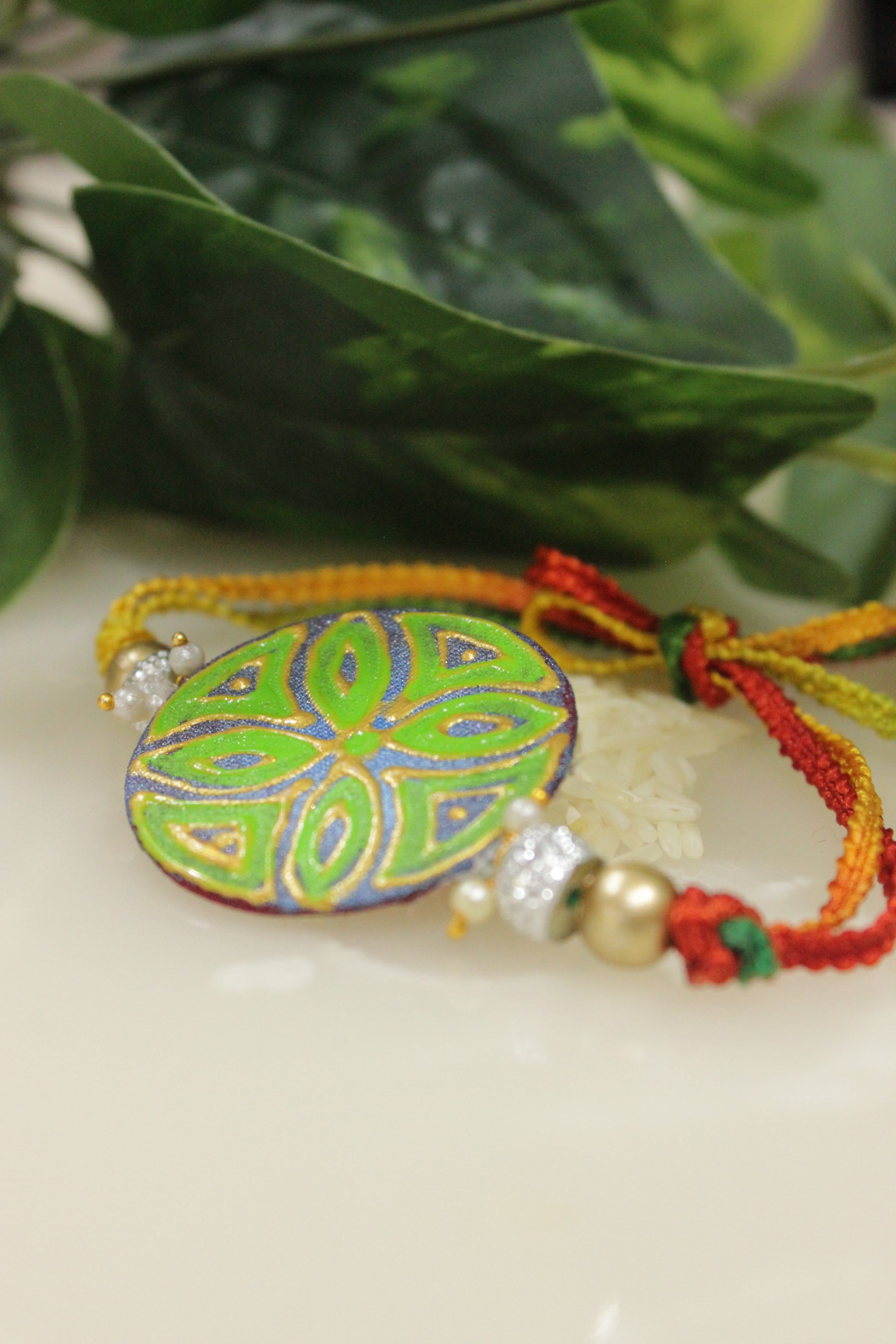 Fabric Hand Painted Flower Motifs and Kundan Work Rakhi