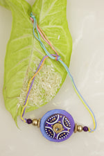 Load image into Gallery viewer, Fabric and Terracotta Clay Hand Painted Rakhi
