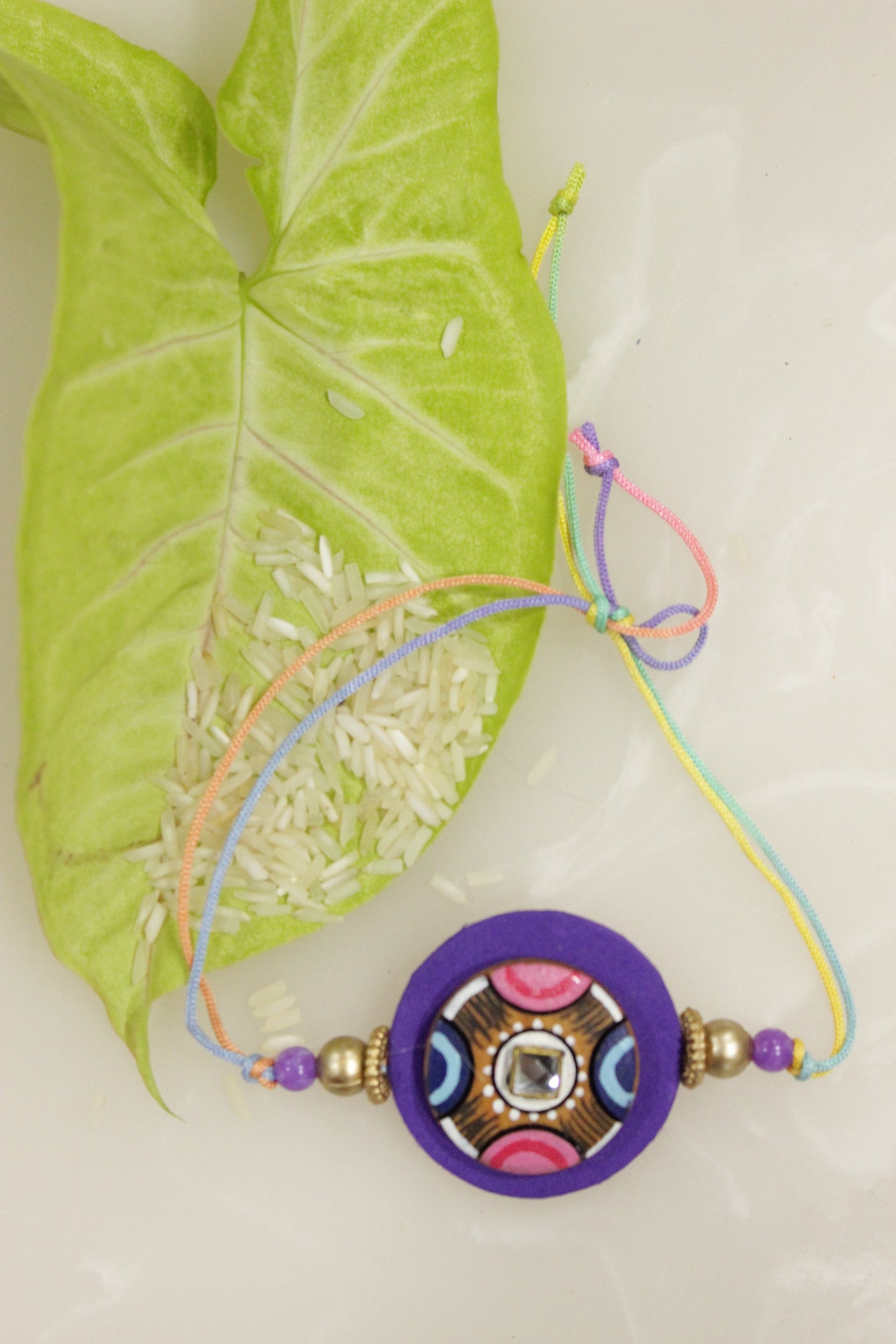 Fabric and Terracotta Clay Hand Painted Rakhi