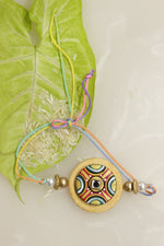 Load image into Gallery viewer, Fabric and Terracotta Clay Golden Hand Painted Rakhi
