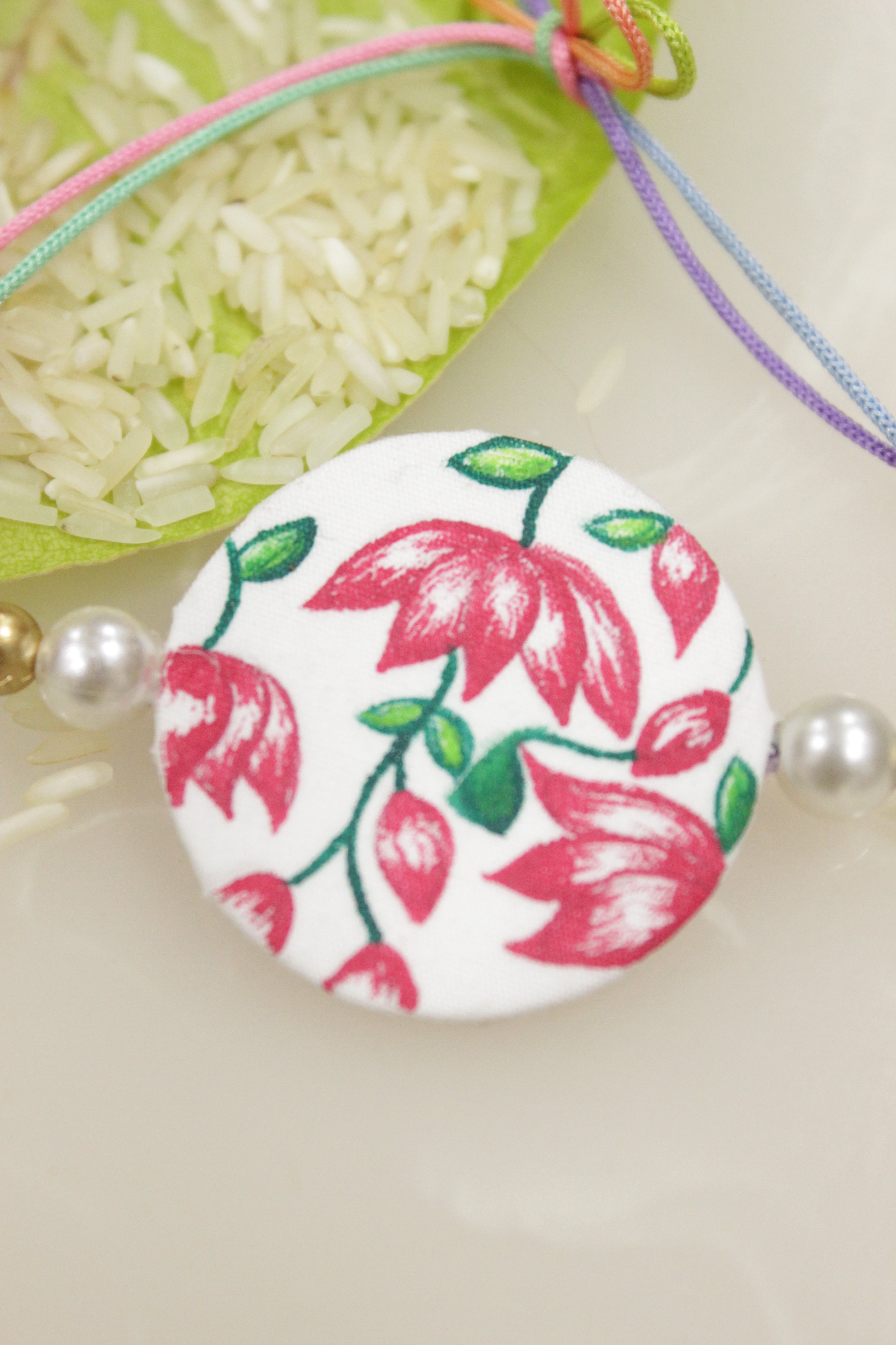 White Fabric Lotus Flowers Hand Painted Rakhi