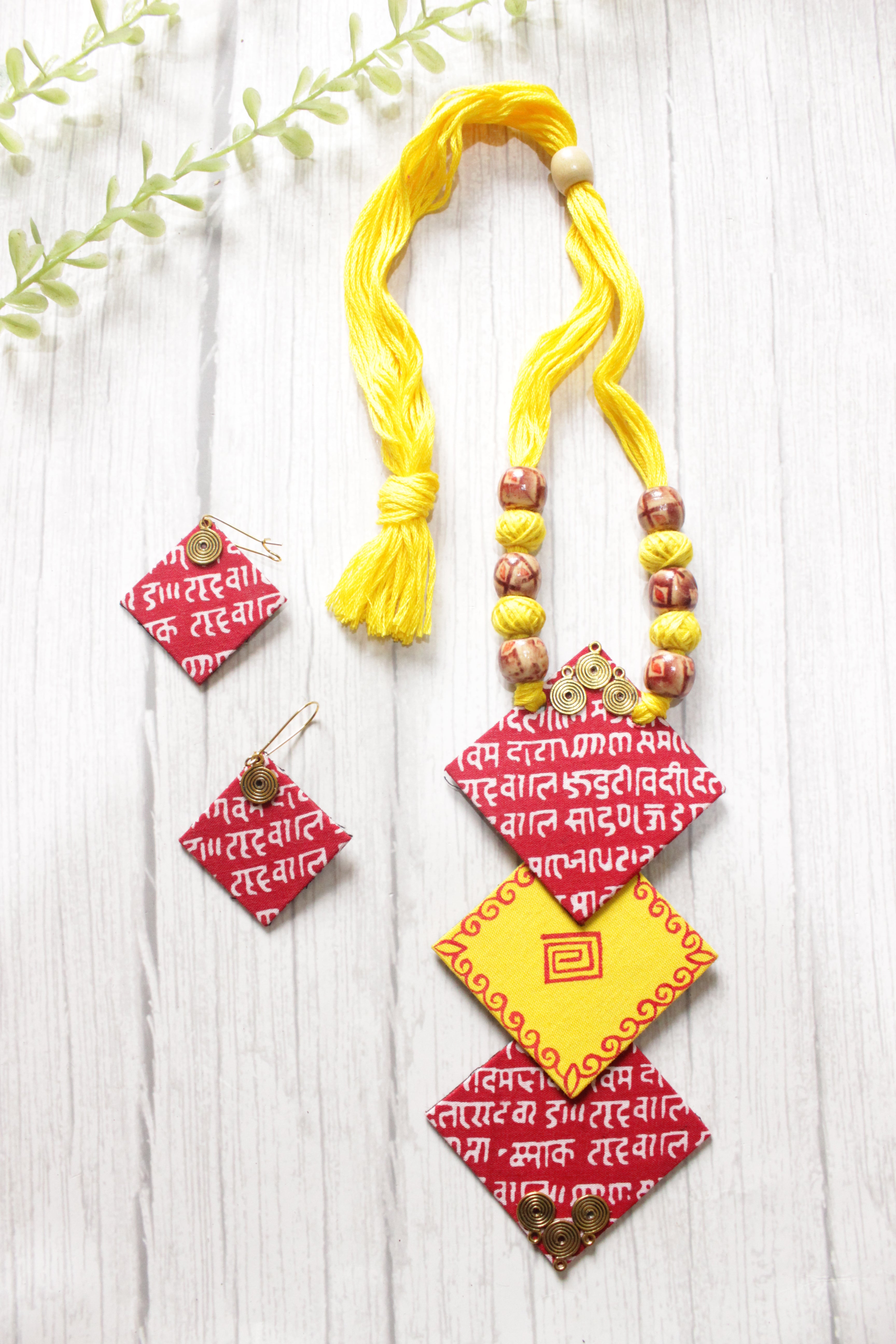 Mantra Printed 3 Layer Pendant Red & Yellow Fabric Necklace Set with Adjustable Thread Closure Necklace Set