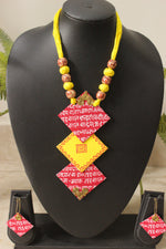 Load image into Gallery viewer, Mantra Printed 3 Layer Pendant Red &amp; Yellow Fabric Necklace Set with Adjustable Thread Closure Necklace Set
