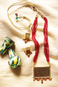 Intricately Detailed Gold Toned Rectangular Pendant Necklace Set with Multi-Layer Red Beads Closure