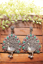 Load image into Gallery viewer, Red &amp; Green Stones Embedded Intricately Detailed Peacock Statement Earrings
