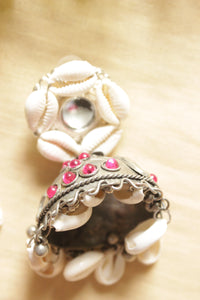 Pink Stones Embedded Oxidised Silver Finish Shell Work Jhumka Earrings