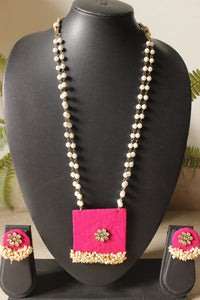 Fuchsia Fabric Gold Toned Necklace Set Embellished with Kundan Stones and Pearls