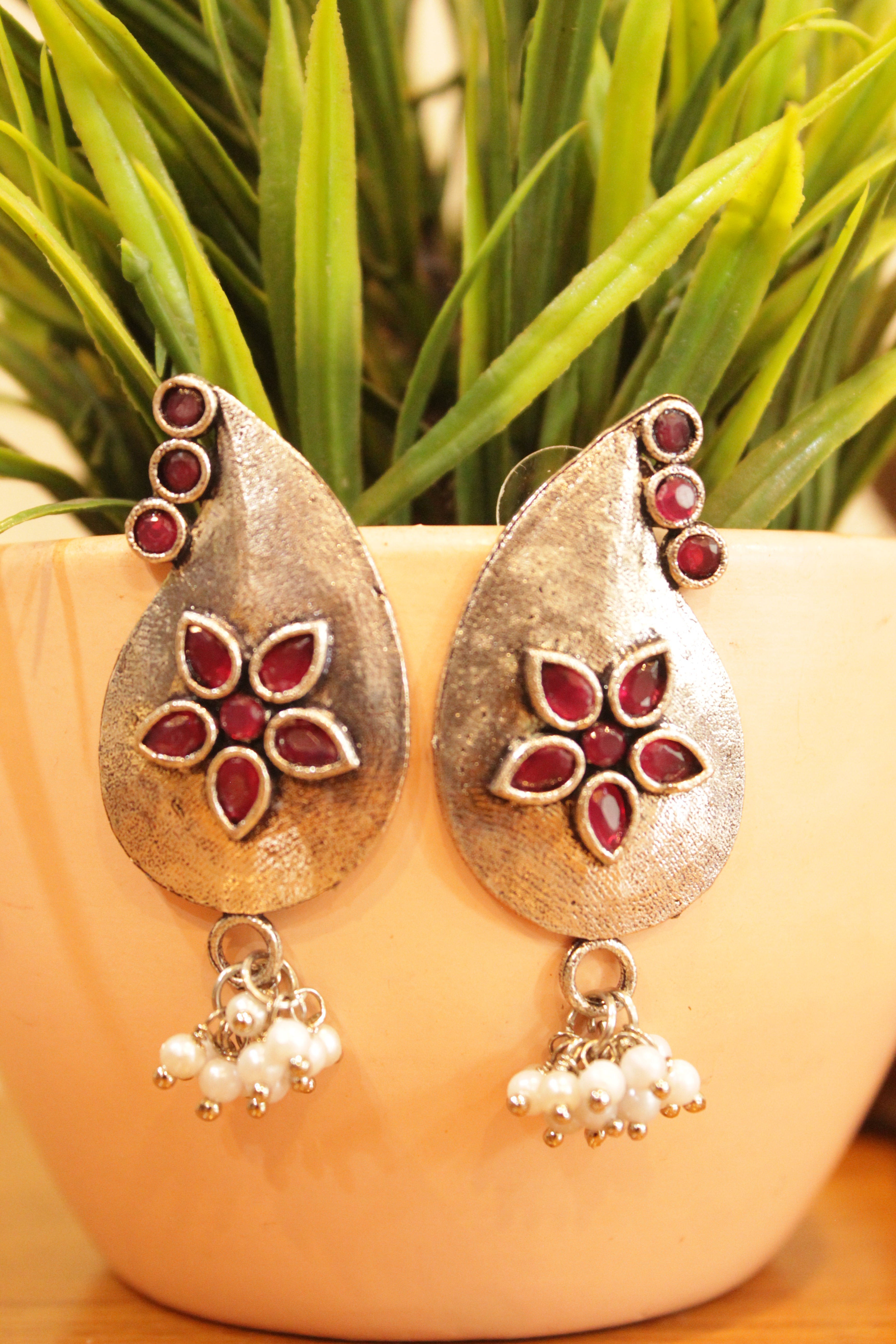Tear Drop Shape Red Stones Embedded Flower Motifs Oxidised Finish Earrings