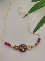 Load image into Gallery viewer, Simple Yet Elegant Wooden Centerpiece Rakhi with Metal and Beads Detailing
