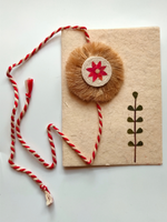 Load image into Gallery viewer, Eco-Friendly Handmade Jute Flower Rakhi with Dried Leaves and Flower Petals (Comes with a Reusable Cloth Pouch and Recycled Paper Card)
