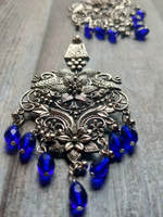 Load image into Gallery viewer, Flowers Motif Jali Pattern Statement Dangler Earrings with Blue Glass Beads
