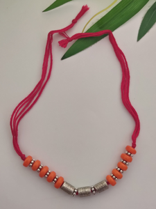 Orange Wooden Beads and Metal Beads Rakhi with Pink Cotton Thread