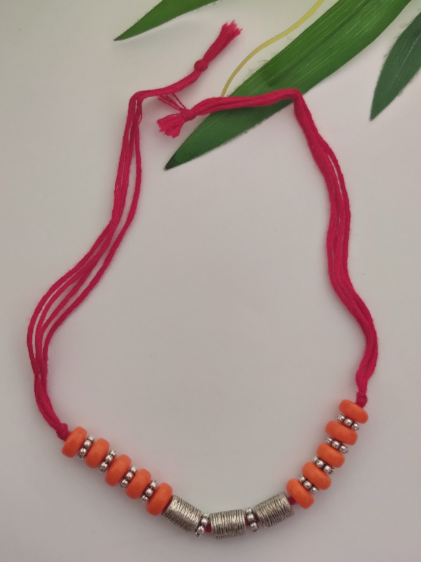 Orange Wooden Beads and Metal Beads Rakhi with Pink Cotton Thread