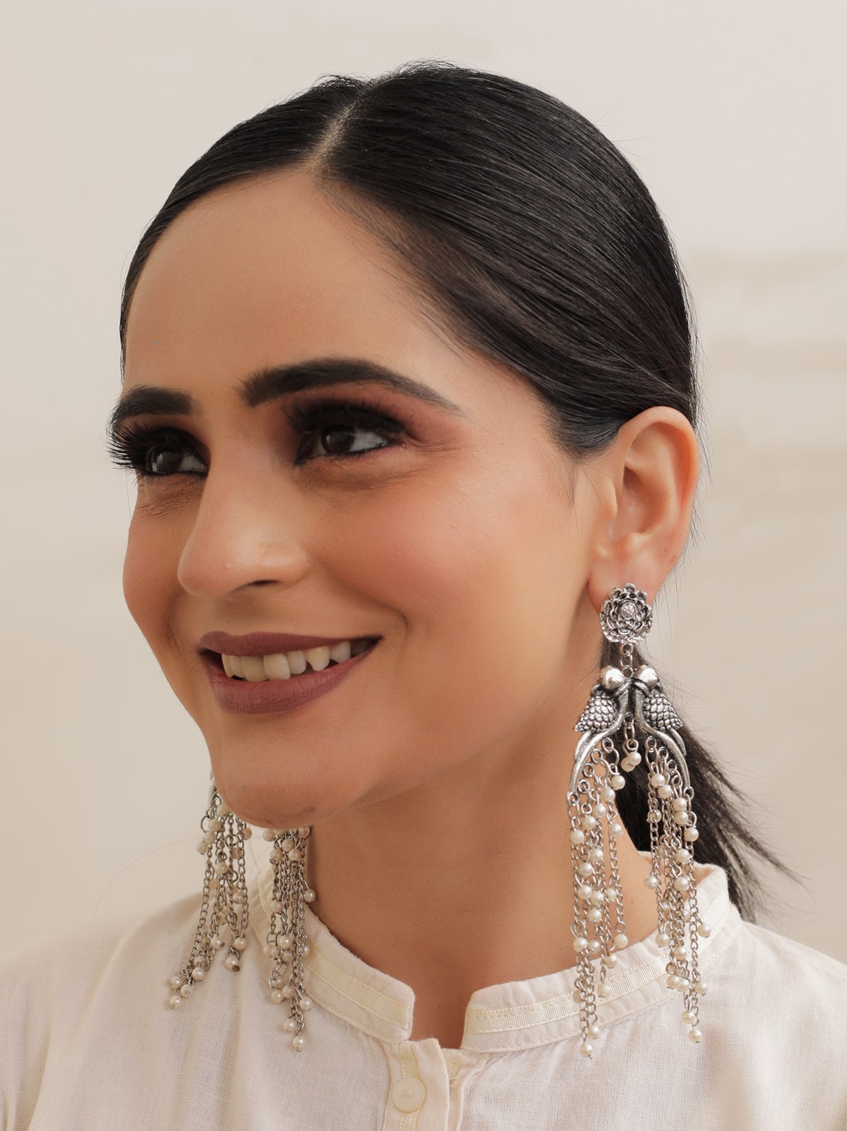 Intricately Crafted Long Peacock Earrings with White Beads