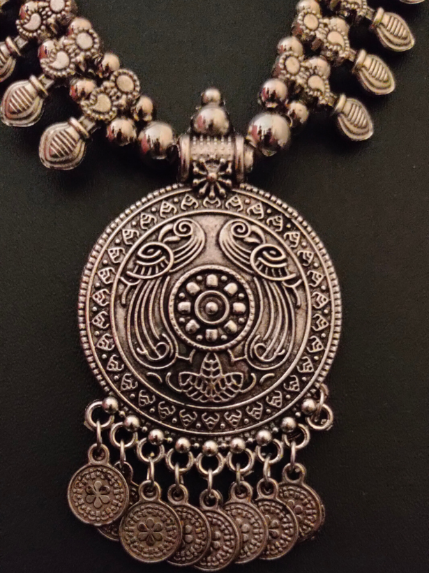 Intricately Crafted Metal Necklace with Coins and Peacock Detailing