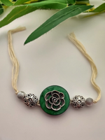 Load image into Gallery viewer, Intricately Detailed Wood and Metal Rakhi with Off-White Cotton Thread

