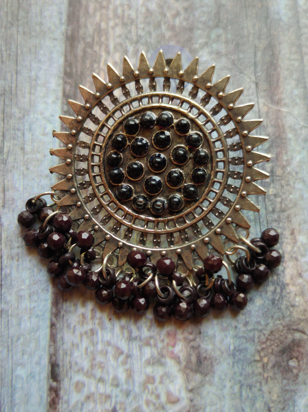 Sun Shaped Metal Earrings with Concentric Circles and Black Beads