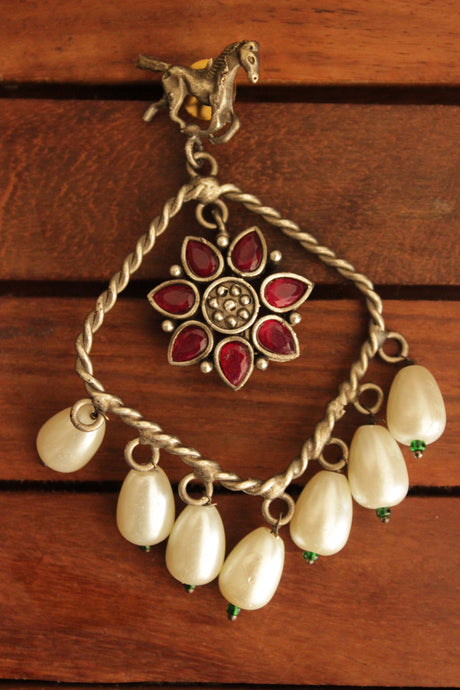 Horse Motif Ruby Stone Embedded Oxidised Finish Brass Earrings Accentuated with White Pearl Danglers