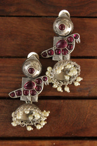 Ruby Red Glass Stones Embedded Oxidised Finish Brass Jhumka Earrings Detailed with White Pearl Beads