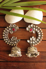 Load image into Gallery viewer, Kundan Stones Embedded Peacock Shape Premium Oxidised Finish Jhumka Earrings
