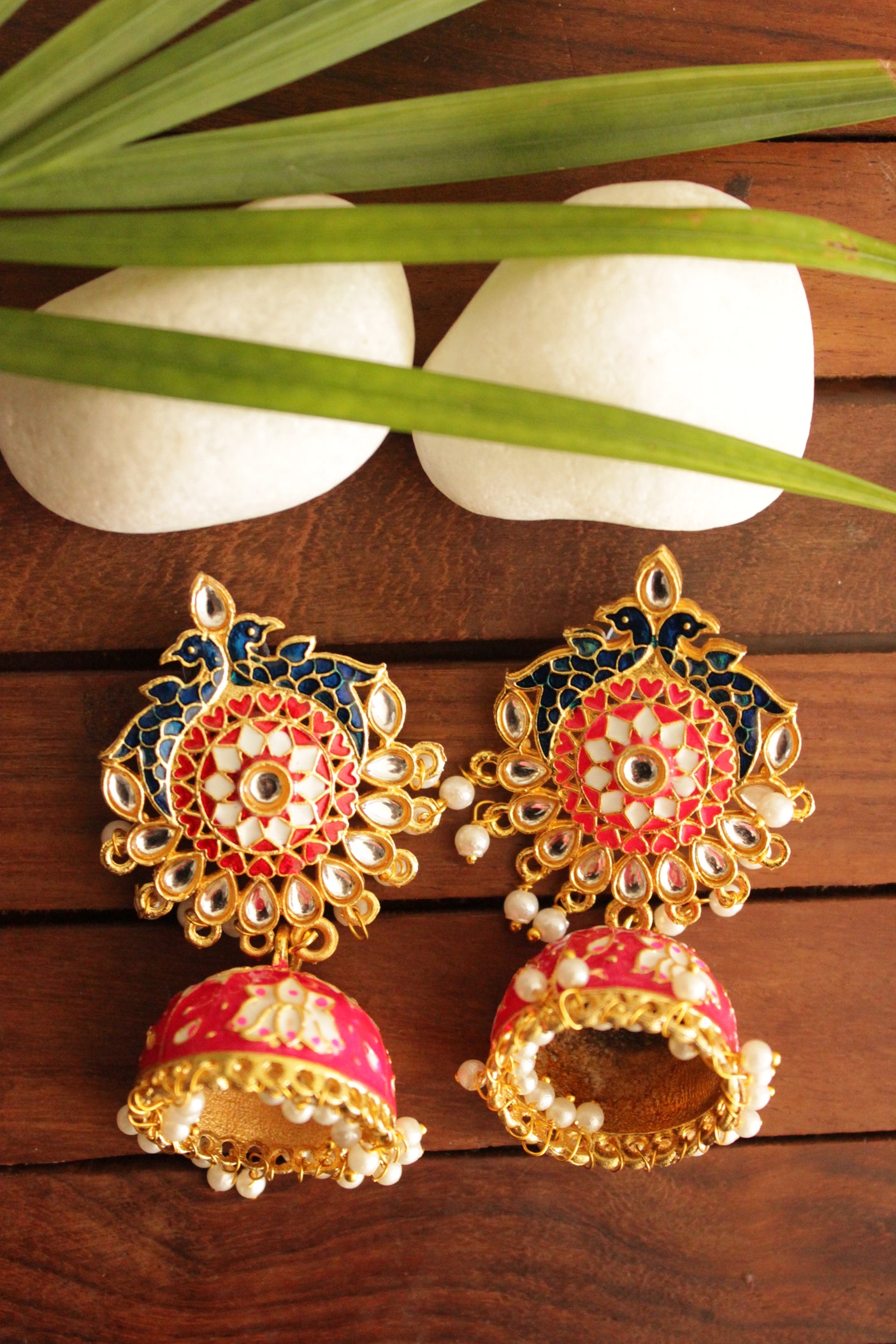 Elaborate Kundan Stones Embedded Gold Toned Hand Painted Peacock Motifs Pink Meenakari Jhumka Earrrings