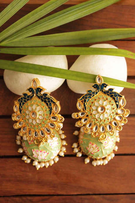 Elaborate Kundan Stones Embedded Gold Toned Hand Painted Peacock Motifs Mint Green Meenakari Jhumka Earrrings