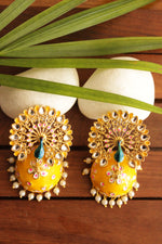 Load image into Gallery viewer, Elaborate Peacock Gold Toned Hand Painted Kundan Stones Embedded Yellow Meenakari Jhumka Earrrings
