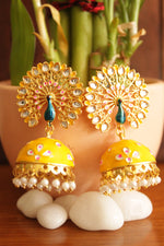 Load image into Gallery viewer, Elaborate Peacock Gold Toned Hand Painted Kundan Stones Embedded Yellow Meenakari Jhumka Earrrings
