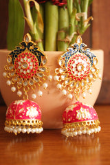 Elaborate Kundan Stones Embedded Gold Toned Hand Painted Peacock Motifs Pink Meenakari Jhumka Earrrings