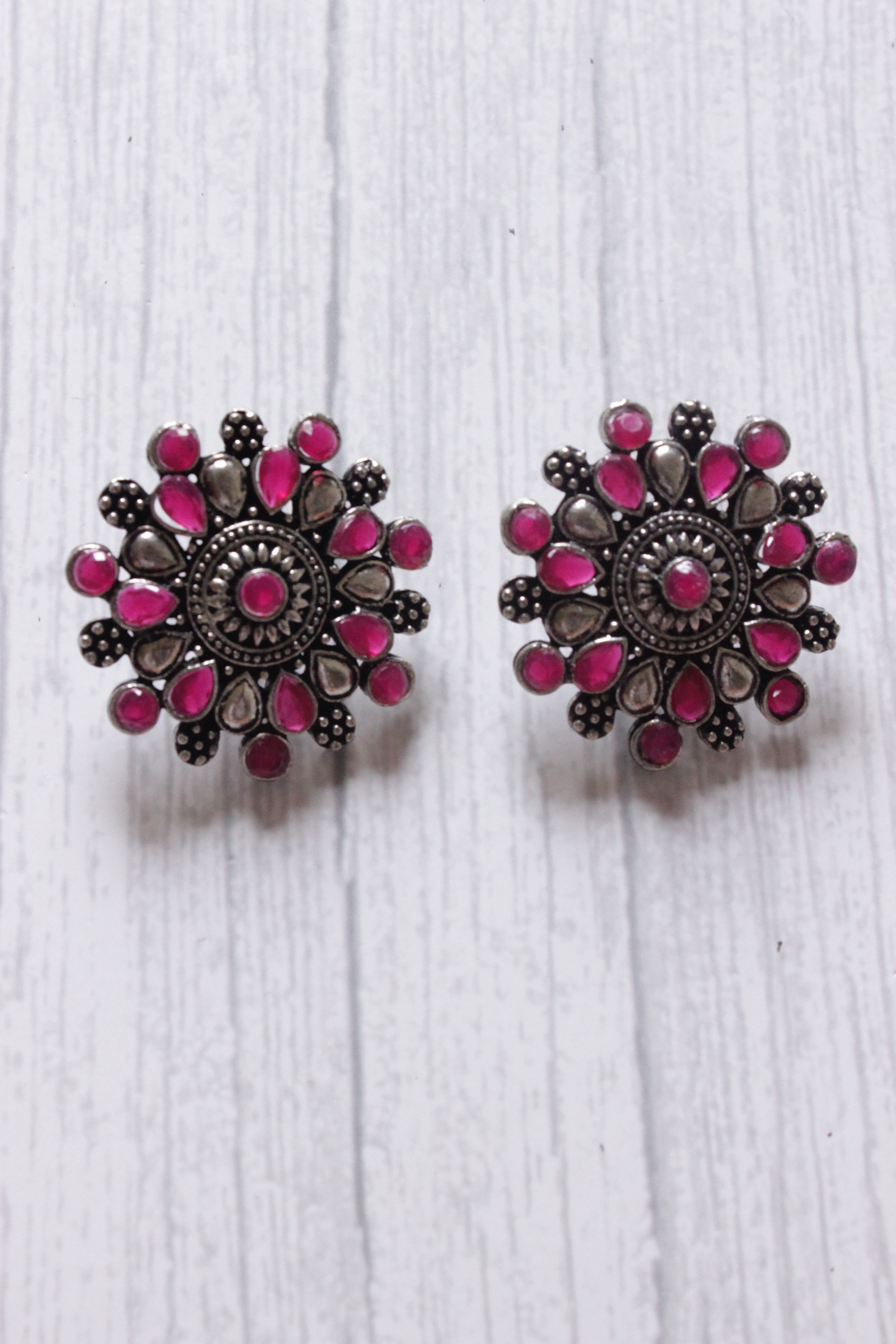 Red Stones Embedded Oxidised Silver Finish Statement Stud Earrings