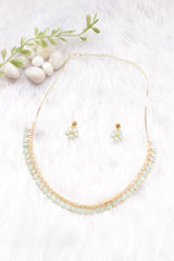 Turquoise Stones and American Diamond Studded Delicate Gold Finish Necklace Set