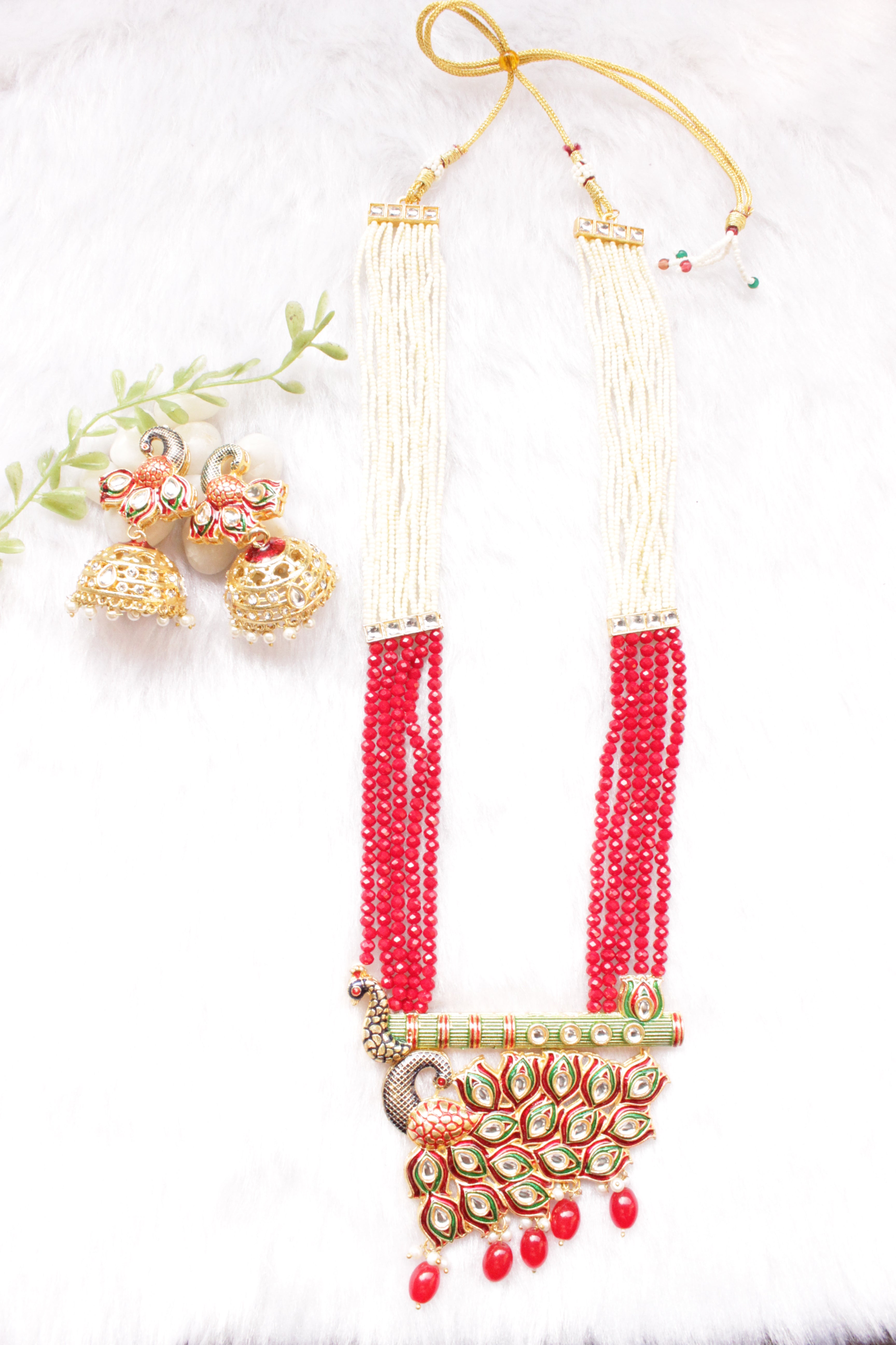 Kundan Stones Embedded Enamel Painted Peacock and Bansuri Motif Pendant Multi-Layer Red Beads Necklace Set