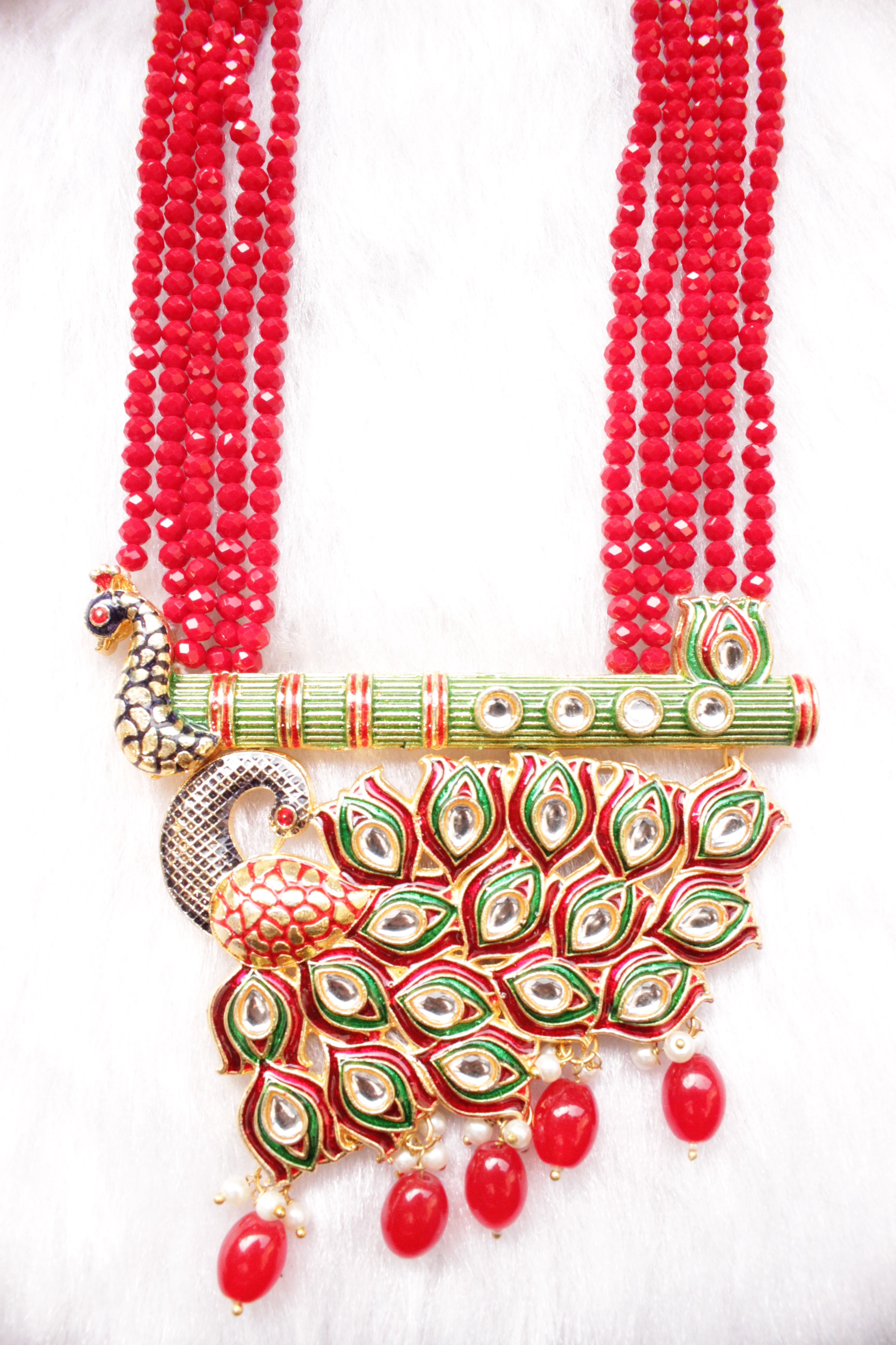 Kundan Stones Embedded Enamel Painted Peacock and Bansuri Motif Pendant Multi-Layer Red Beads Necklace Set