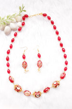 Load image into Gallery viewer, Hand Painted Meenakari Red Acrylic Beads Braised with Red Beads and Kundan Stones Embedded Necklace Set

