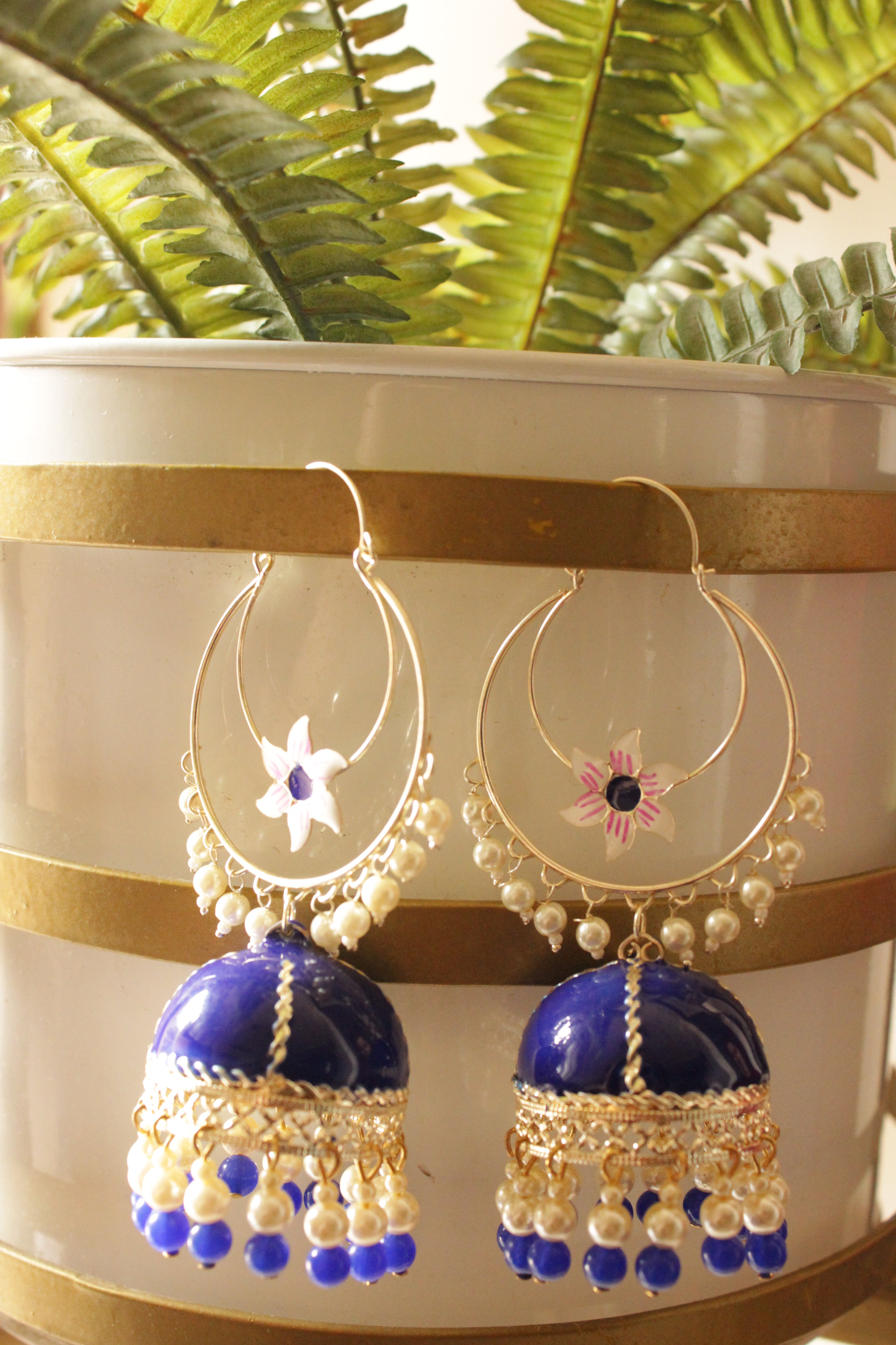 Royal Blue Hand Painted Meenakari Work Gold Toned Hoop Jhumka Earrings Accentuated with White and Blue Beads