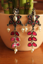 Load image into Gallery viewer, Ruby Red Glass Stones Embedded Oxidised Finish Tear Drop Flower Shaped Dangler Earrings
