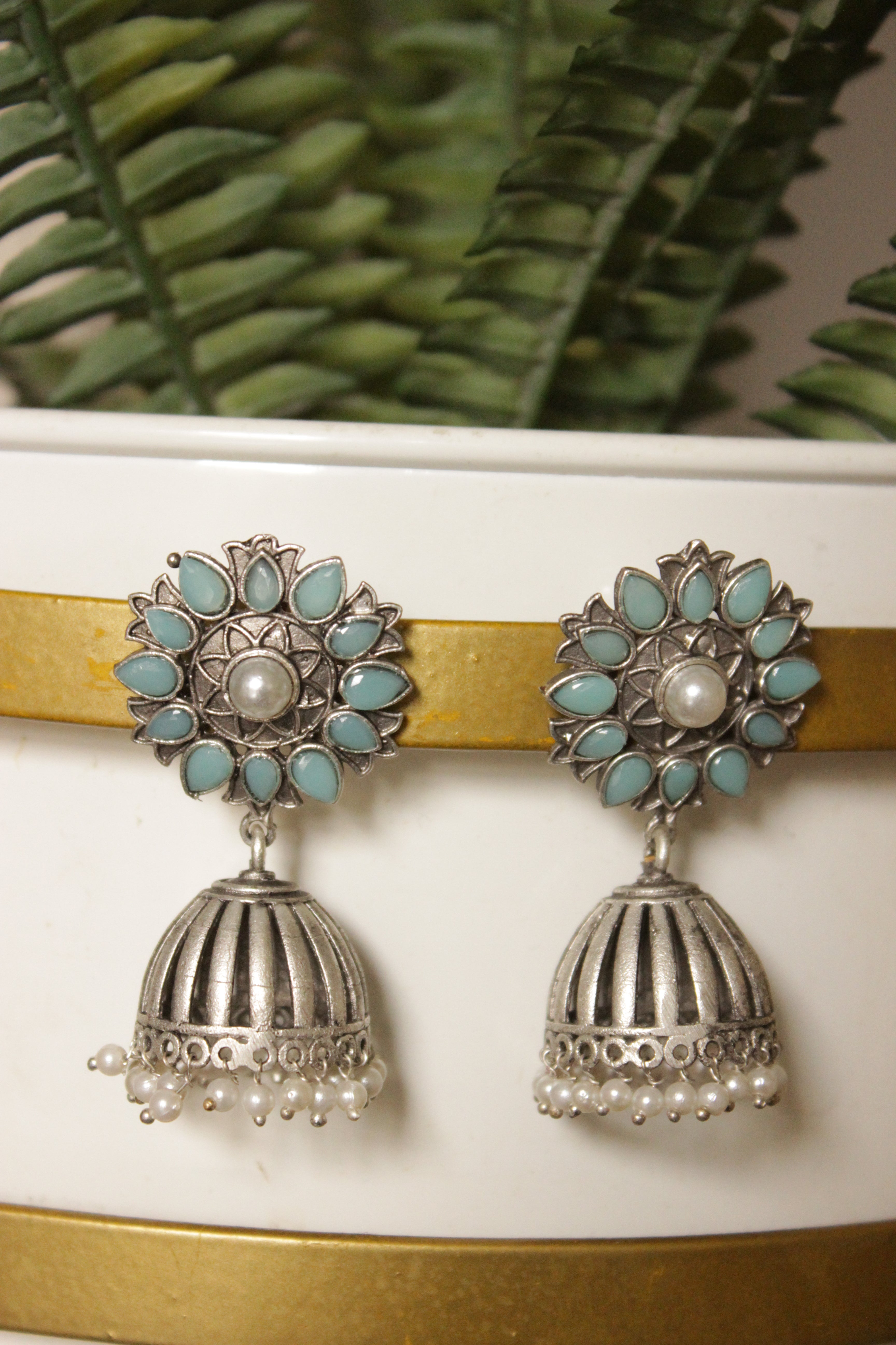 Turquoise Natural Gemstones Embedded Silver Finish Brass Jhumka Earrings