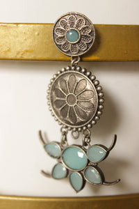 Turquoise Natural Gemstones Embedded Oxidised Finish Flower Brass Jhumka Earrings